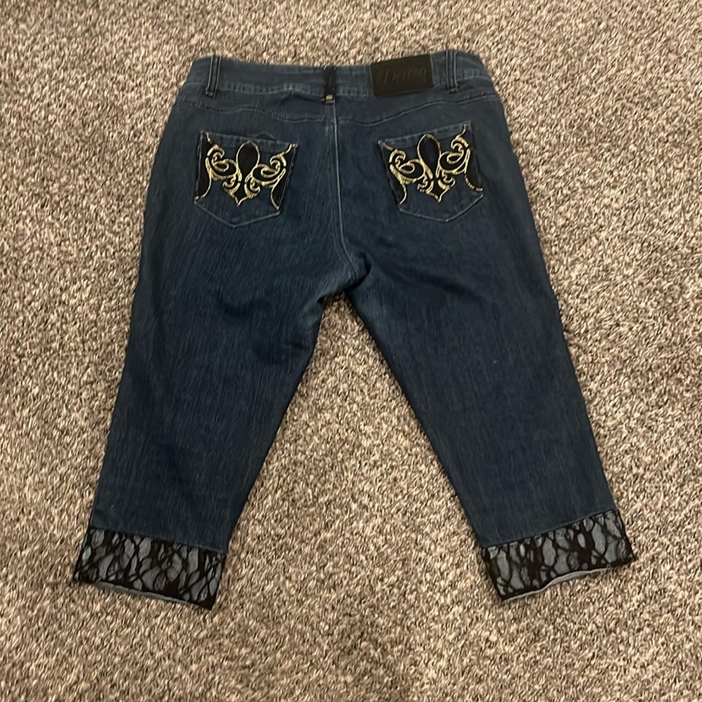 Dereon jeans with lace cuffs and lace pockets
